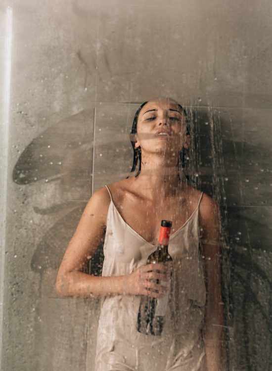 stock-photo-lonely-depressed-woman-shower-wine (1)